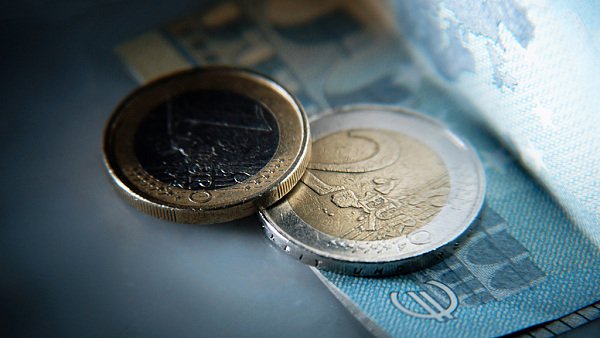 Euro bill and euro coin